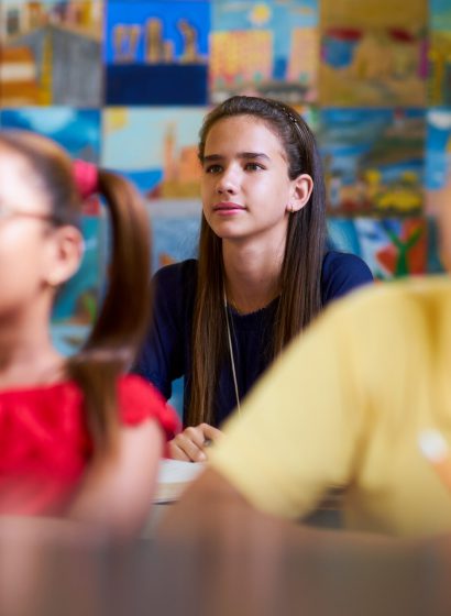 smart-girl-listening-to-teacher-at-school-PQV6SHN-Copier.jpg